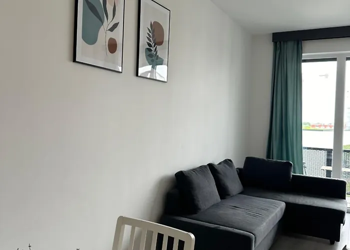 Modern Riverside Apartmen With A Balcony And Garage
